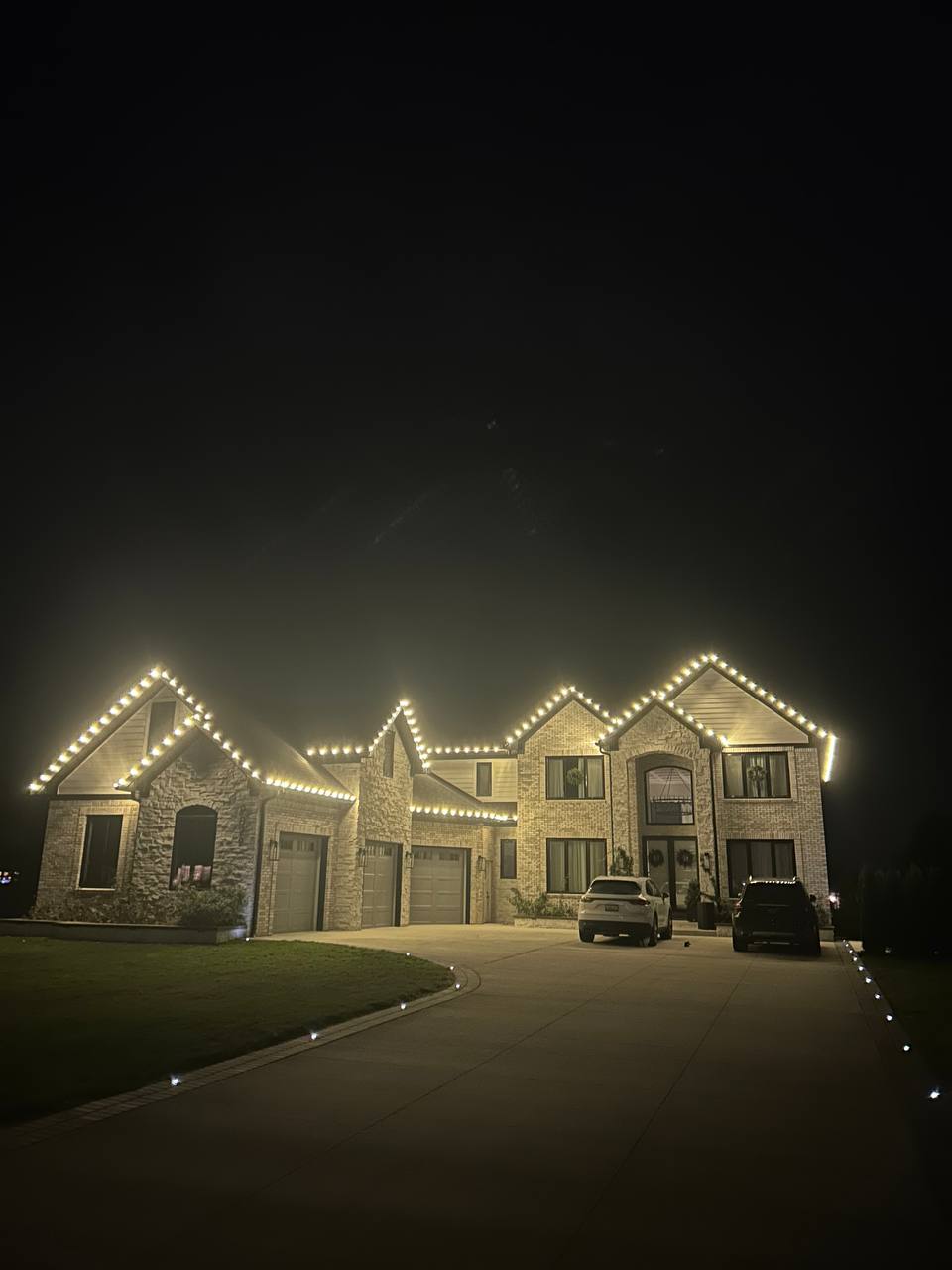 Commercial holiday lighting installation on a dealership building